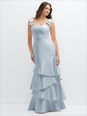 Bow-shoulder satin maxi dress in light blue with asymmetrical tiered ruffle hem