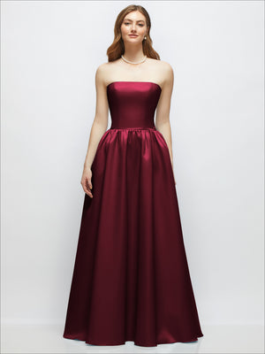 Strapless satin drop-waist gown with full skirt, deep burgundy.