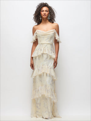 Cream off-shoulder cowl maxi dress with tiered ruffle skirt and layered flutter sleeves
