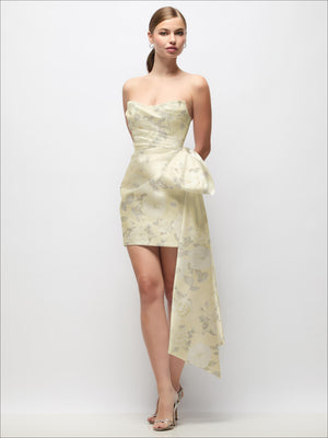 Strapless satin mini dress with pale yellow-green floral print and draped tail bow