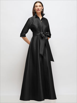 Black satin shirt dress gown with 3/4 sleeves, bow sash, jeweled button placket