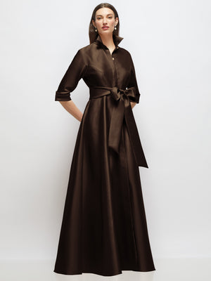 Brown satin shirt dress gown with 3/4 sleeves, jeweled button front, and tied sash bow