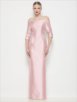 Off-shoulder satin maxi dress in blush pink, three-quarter sleeves with fitted waist and long skirt.