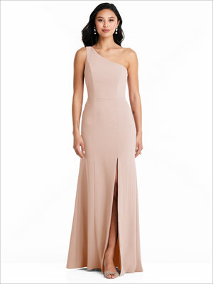 Blush one-shoulder sleeveless bridesmaid dress with front slit and long skirt.