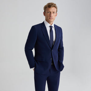 Blue suit jacket, notch lapels, two-button front, flap pockets, long sleeves