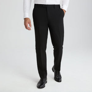 Men's black suit pants with belt loops, zip fly, and slim tapered legs