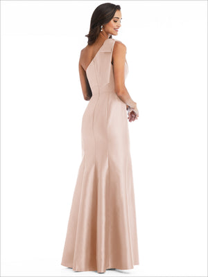 Blush satin one-shoulder trumpet gown with draped bow at the shoulder