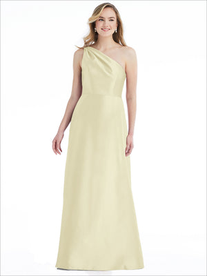 Light pale yellow one-shoulder satin maxi dress with draped bodice and pleated skirt.