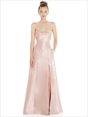 Blush pink satin strapless ball gown with bow at bust and thigh-high slit