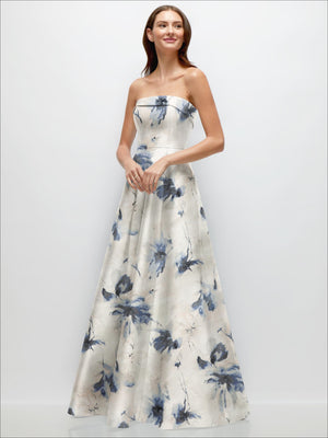 Strapless satin gown with ivory base and dark blue floral print, fitted bodice and full skirt
