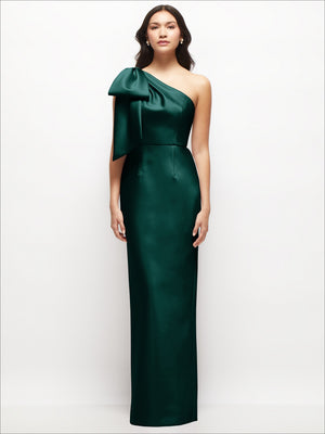 Emerald green one-shoulder satin column maxi dress with oversized bow detail