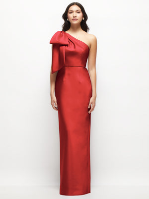 Red one-shoulder satin column maxi dress with oversized bow detail on the shoulder.