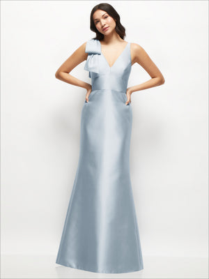 Blue satin trumpet dress with deep V neckline and one-shoulder cascading bow detail