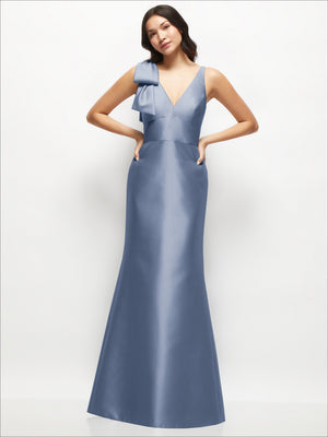 Powder blue satin trumpet dress with deep V-back and one-shoulder cascading bow.