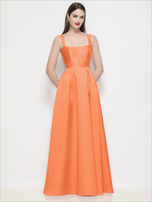 Orange satin maxi dress with shaped straps and pleated skirt, fitted bodice.