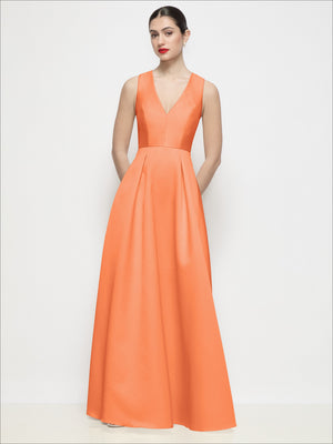 Peach satin V-neck sleeveless maxi dress with pleated skirt and fitted waist