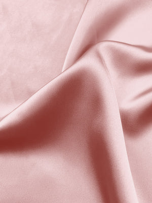 Light pink stretch charmeuse fabric with smooth satin sheen and drape, by the yard.