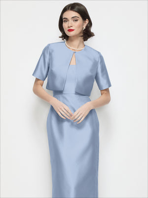 Light blue satin cropped jacket with jewel neckline and short sleeves, straight cropped hem