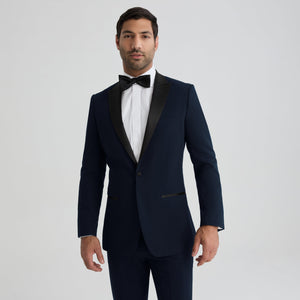 Navy tuxedo jacket with peak lapels, single-breasted front and flap pockets