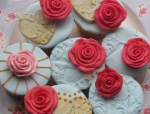 Le Beau Cake runs several decorative cupcake classes red and blue iced cupcakes with roses