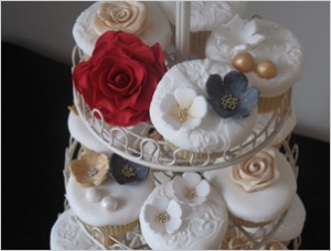 Vintage decorated cupcakes from Le Beau Cake white cupcakes with pearl and roses decorations