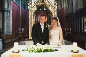 bride and groom at altar in church bride and groom at altar in church