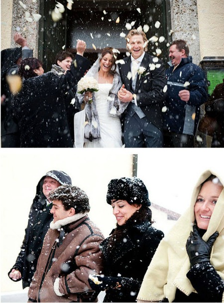 bride and groom leave church in snow bride and groom leave church in snow