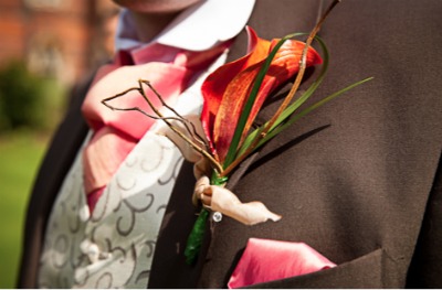grooms buttonhole with red orchid grooms buttonhole with red orchid