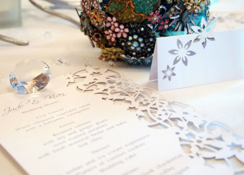 Stationery by Intricate Creations white wedding stationery with cut out design