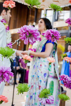 Bride and groom at fusion wedding Couple under Chuppah at fusion wedding