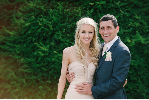 Bride in strapless dress with bridegroom