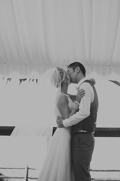 bride and groom beach wedding bride and groom first kiss