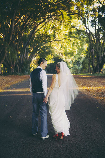 outdoor wedding bride and groom holding hands