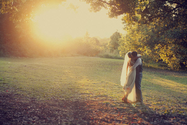 romantic wedding bride and groom at sunset
