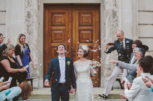 bride in short lace wedding dress with bridegroom