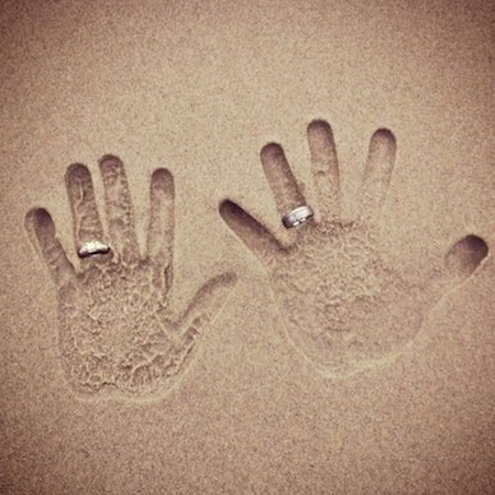 handprints in the sand