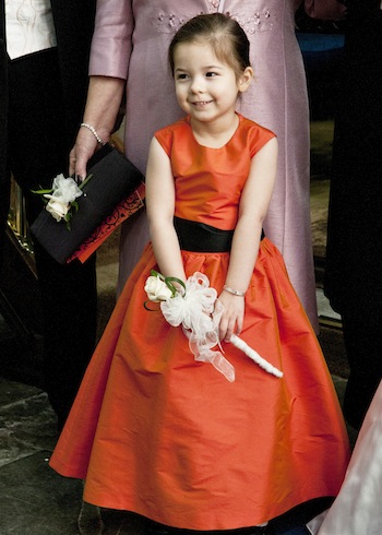 flowergirl in long orange Dessy dress