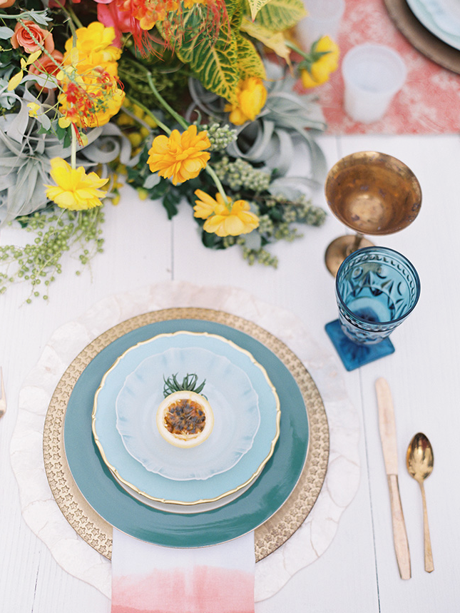 Orange teal and yellow wedding breakfast setting